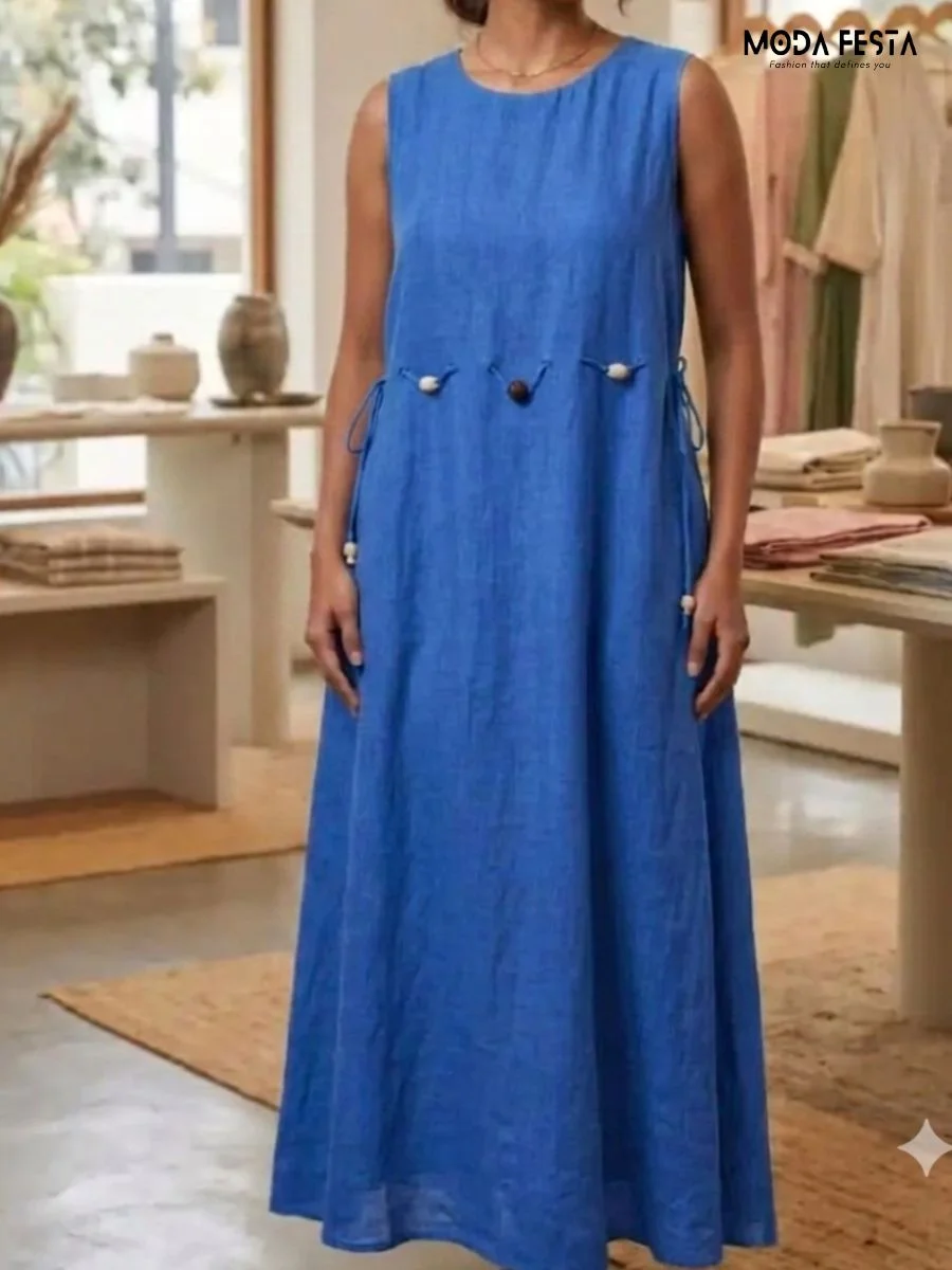 light blue linen sleeveless maxi dress featuring a beaded tie-waist